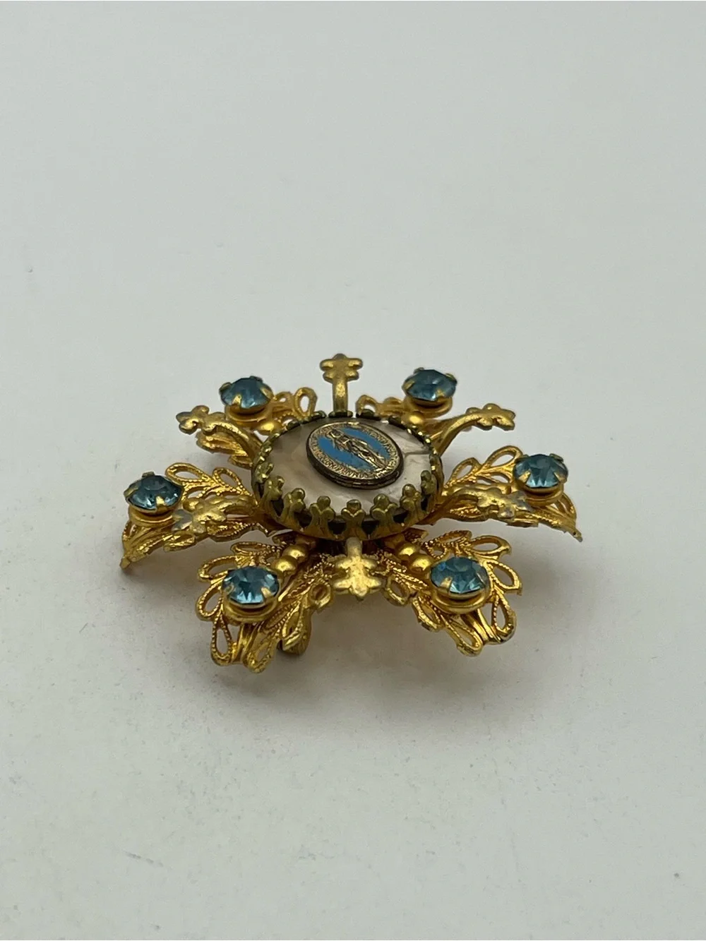 Miraculous medal Catholic Virgin Mary blue rhinestone gold tone starburst brooch